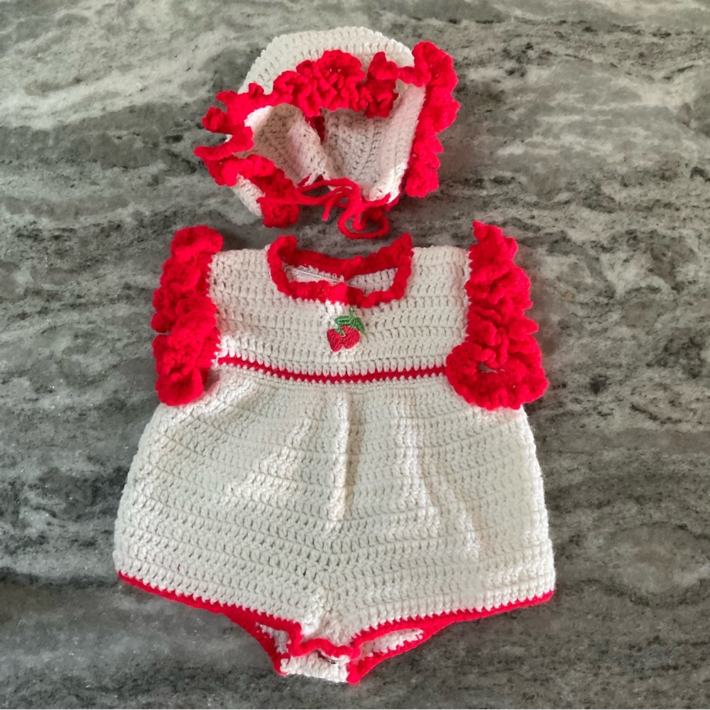 Hand knit baby outfit with matching bonnet hat